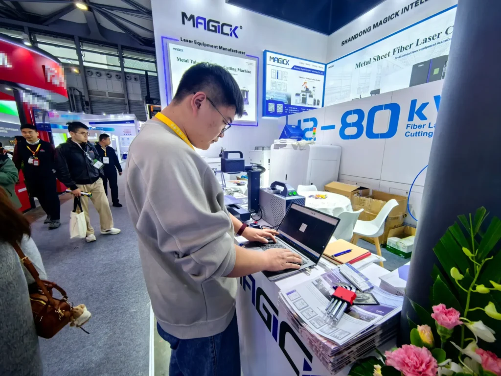 Magick Laser technical engineer providing live consultation and custom laser cutting solutions at Photonics China 2026.