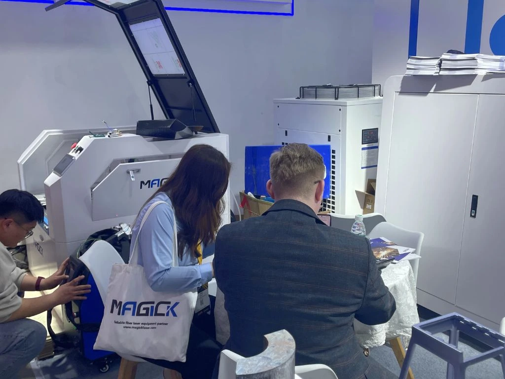 International buyers engaging with Magick Laser technical engineers regarding 80kW cutting technology.