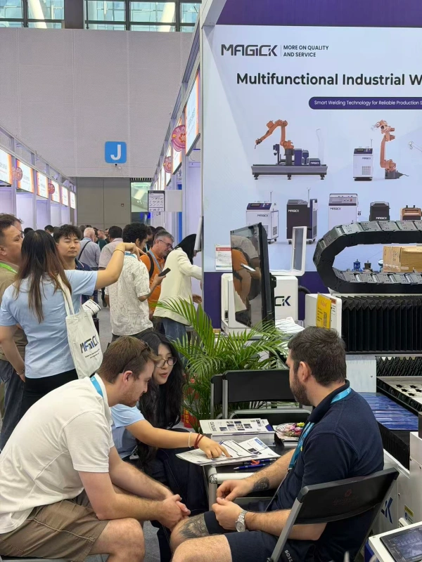 MAGICK representatives introducing industrial laser equipment to visitors at Canton Fair 2026
