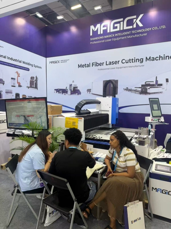 MAGICK team discussing laser equipment solutions with visitors at Canton Fair 2026